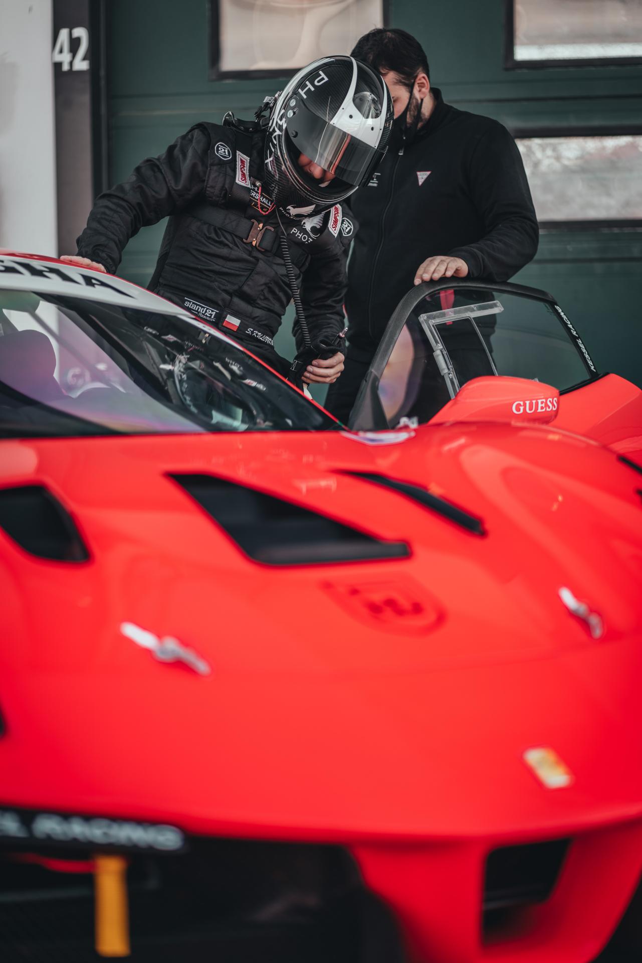 Man walking past his sport car